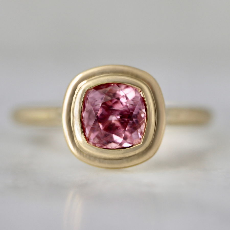 Pink cushion cut spinel ring in bezel setting
