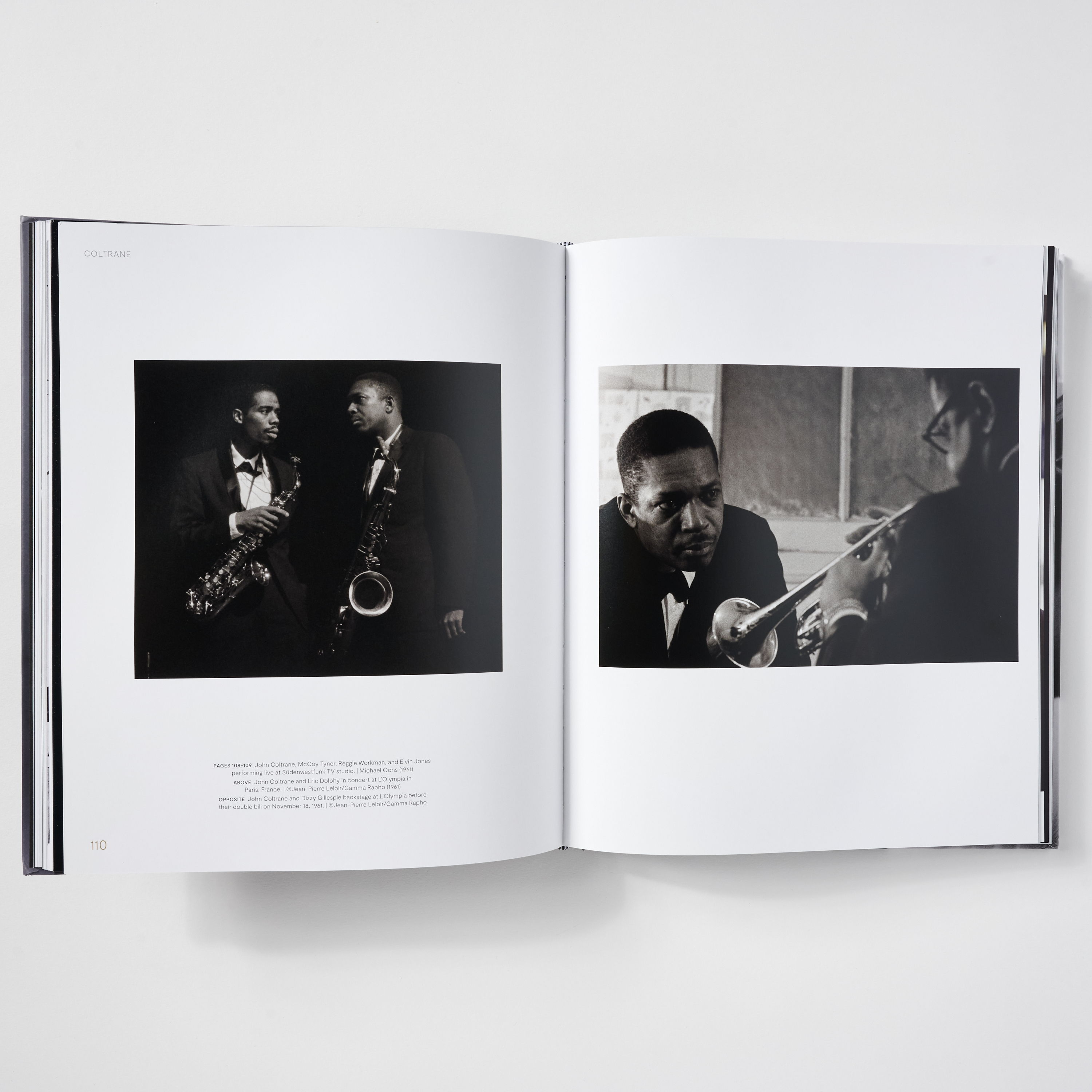 Two black and white photographs of musicians in a book.
