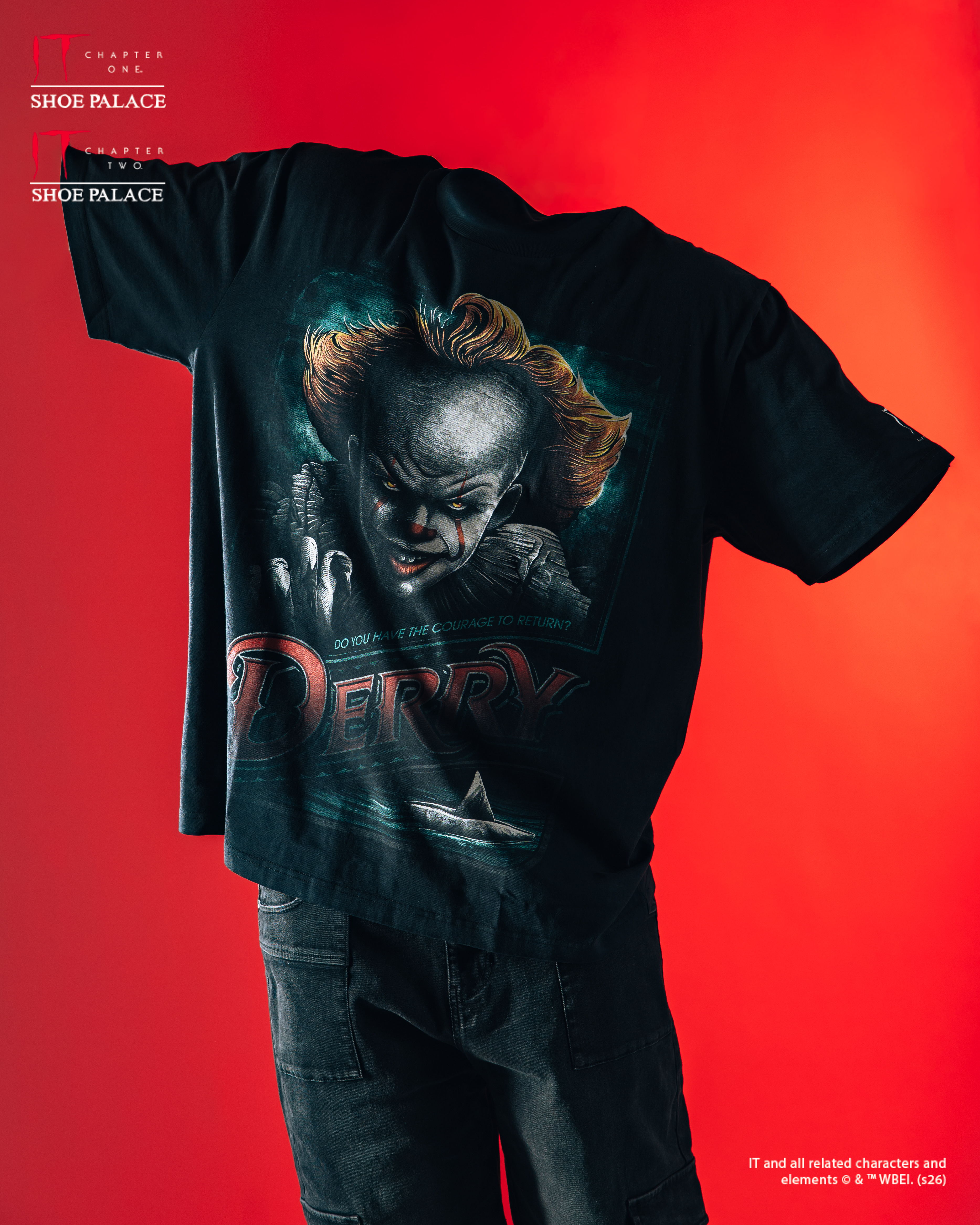 Black t-shirt featuring a graphic of a sinister clown against a red background.