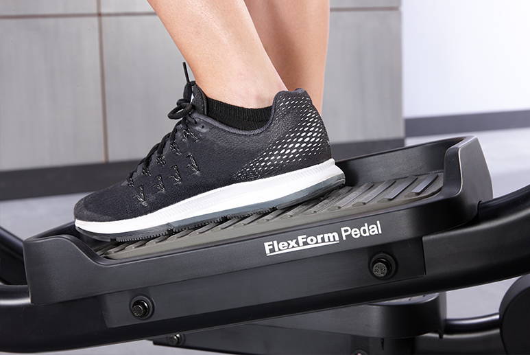 FlexForm oversized pedals on Club Series+ Elliptical with exerciser pedaling