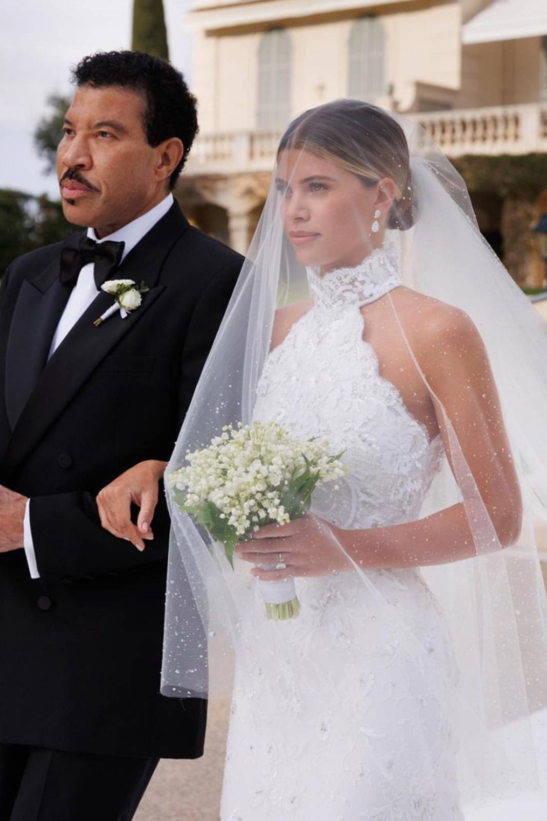 Sofia Richie with her father walking down the aisle