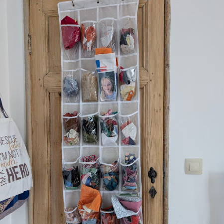 over the door storage solution holding fabric pieces