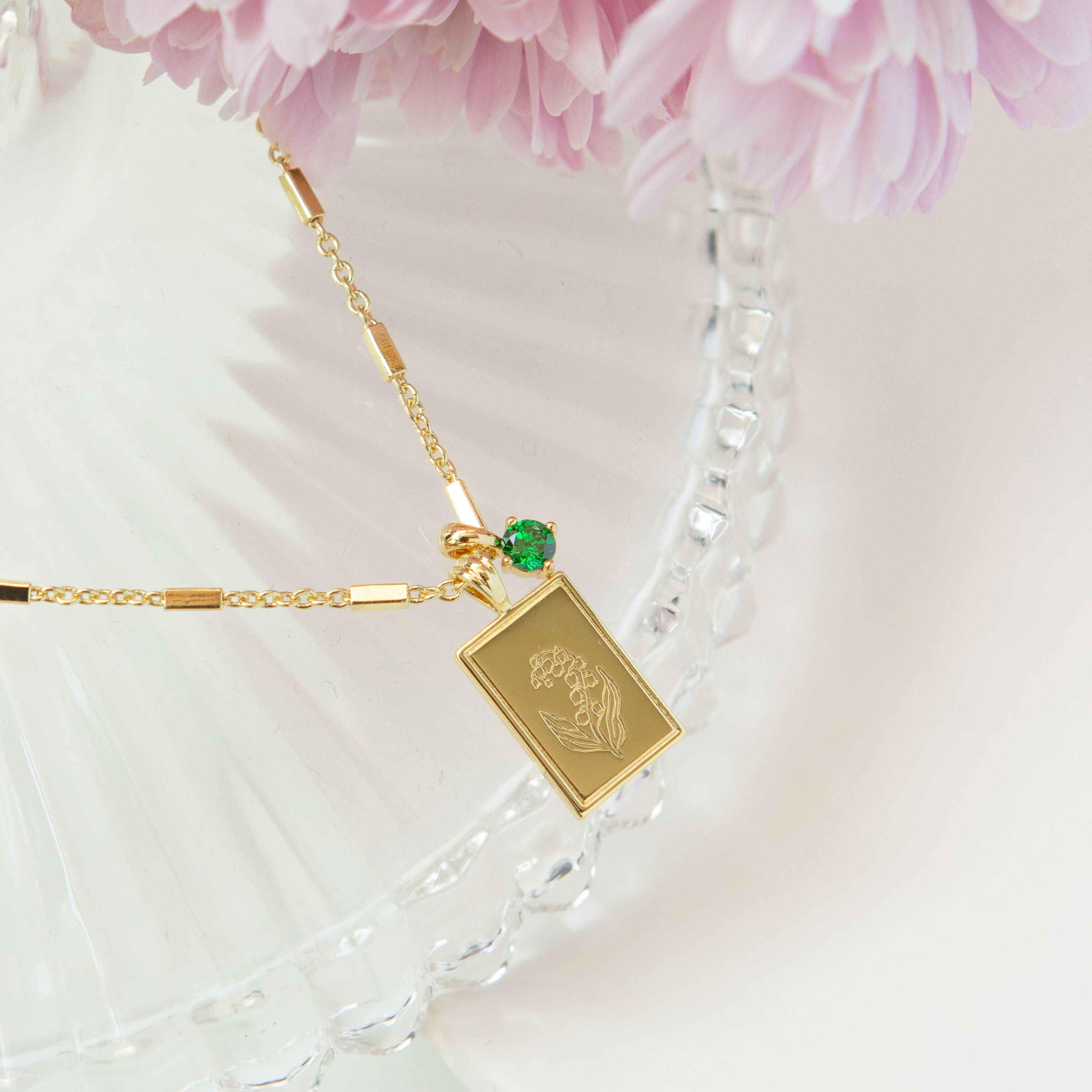 14k Gold Filled Birth Flower Pendant and Birthstone Charm Necklace hanging on a Tara Chain