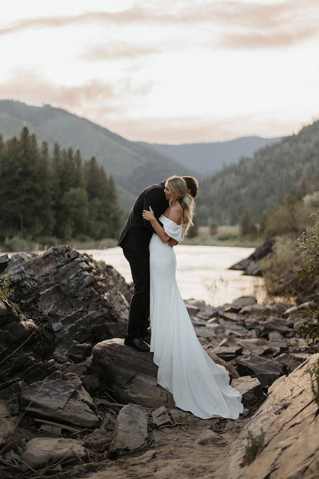 Bride, holding her groom in the valley