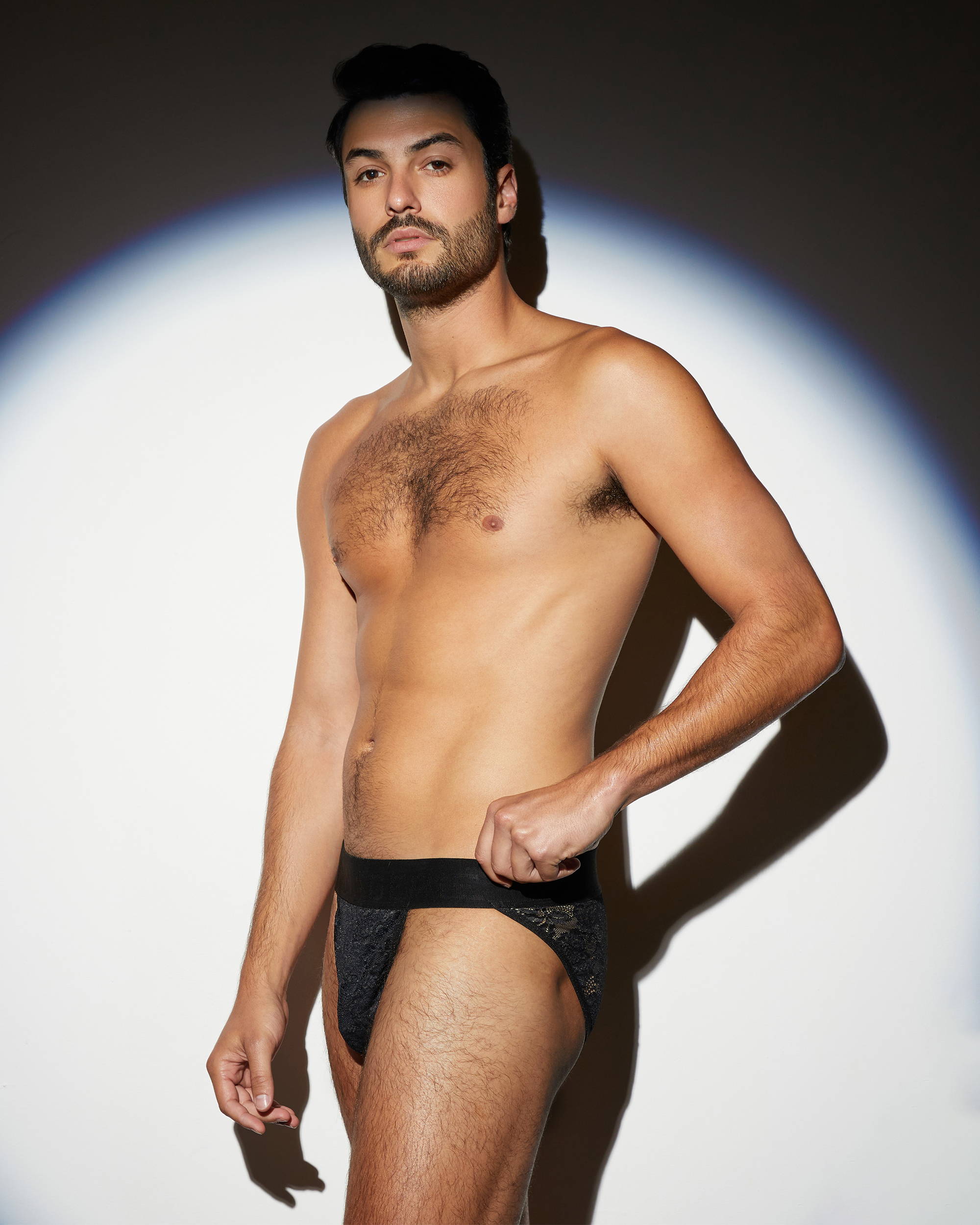 Male model wearing the Menagerie Core Lace Thong