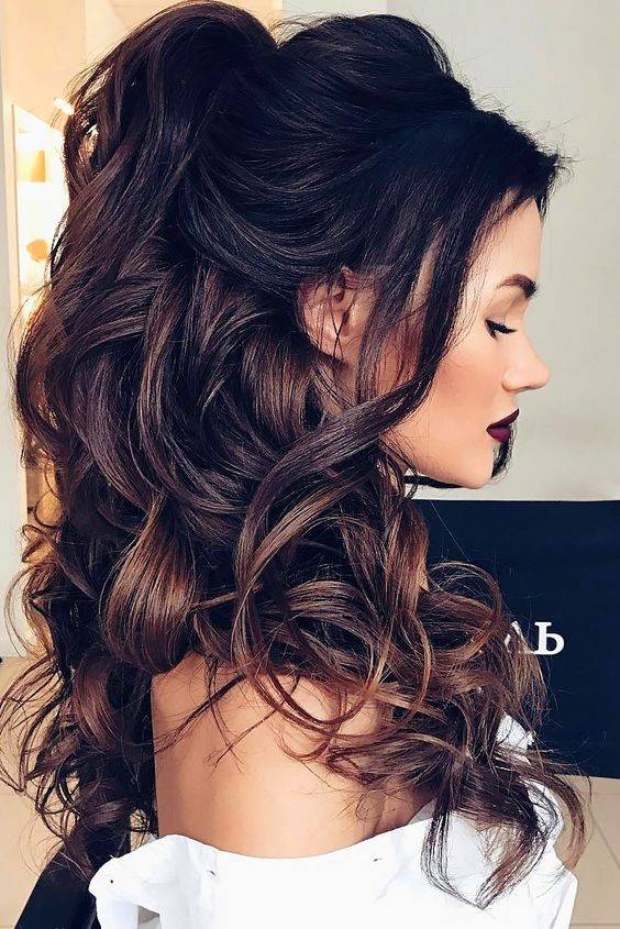 Brunette with curly hair half up and half down