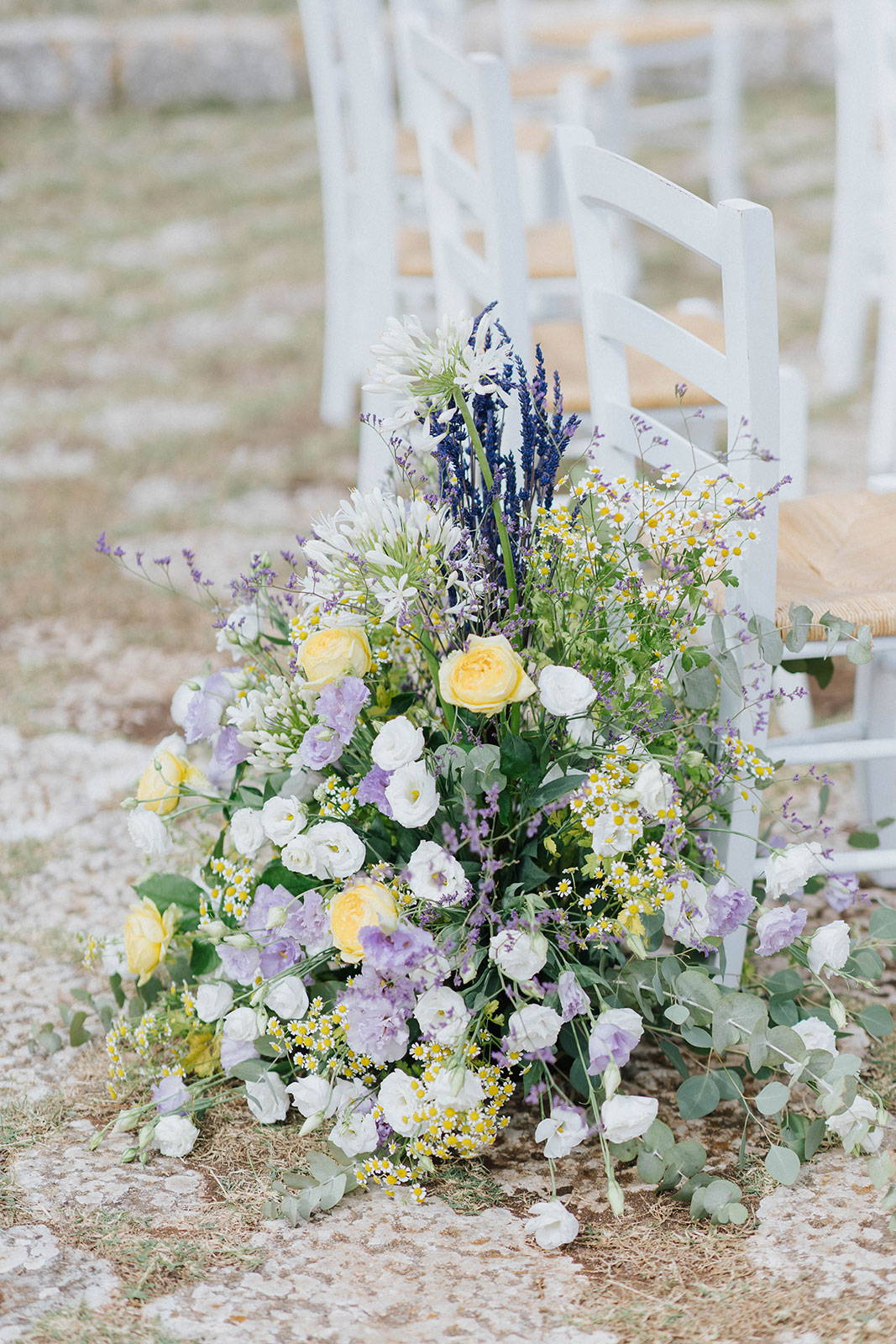 Floral arrangment near wedding chair