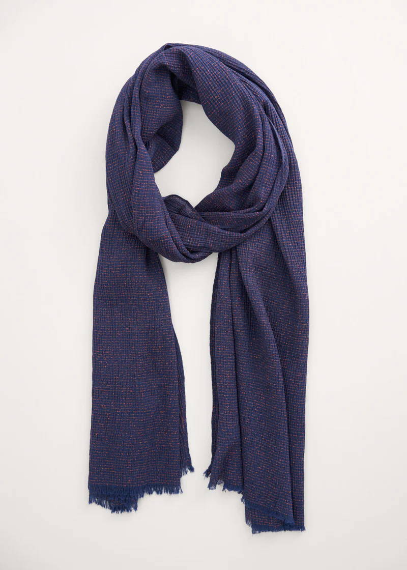 A dark blue scarf with a waffle texture finish