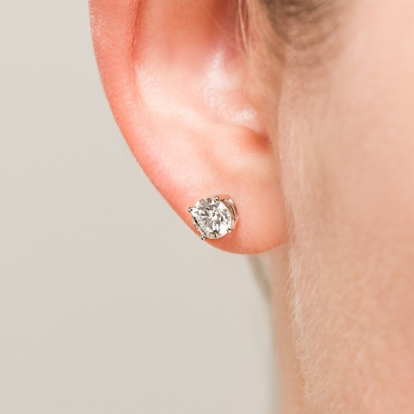 lab grown diamond basket stud earrings as part of the bridal jewelry worn during the wedding day