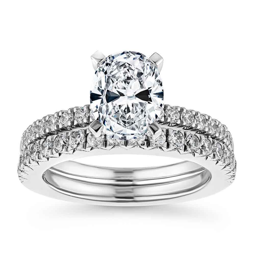 Tiffany novo inspired diamond accented wedding set with oval cut diamond engagement ring