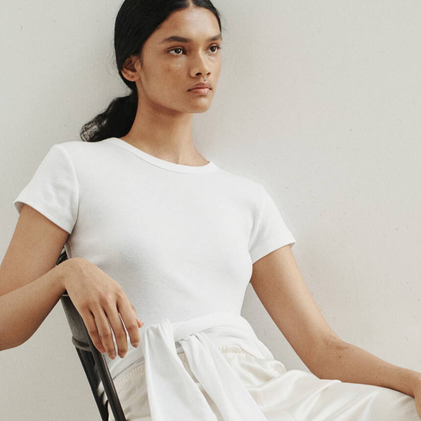 Woman sitting in chair looking into the distance