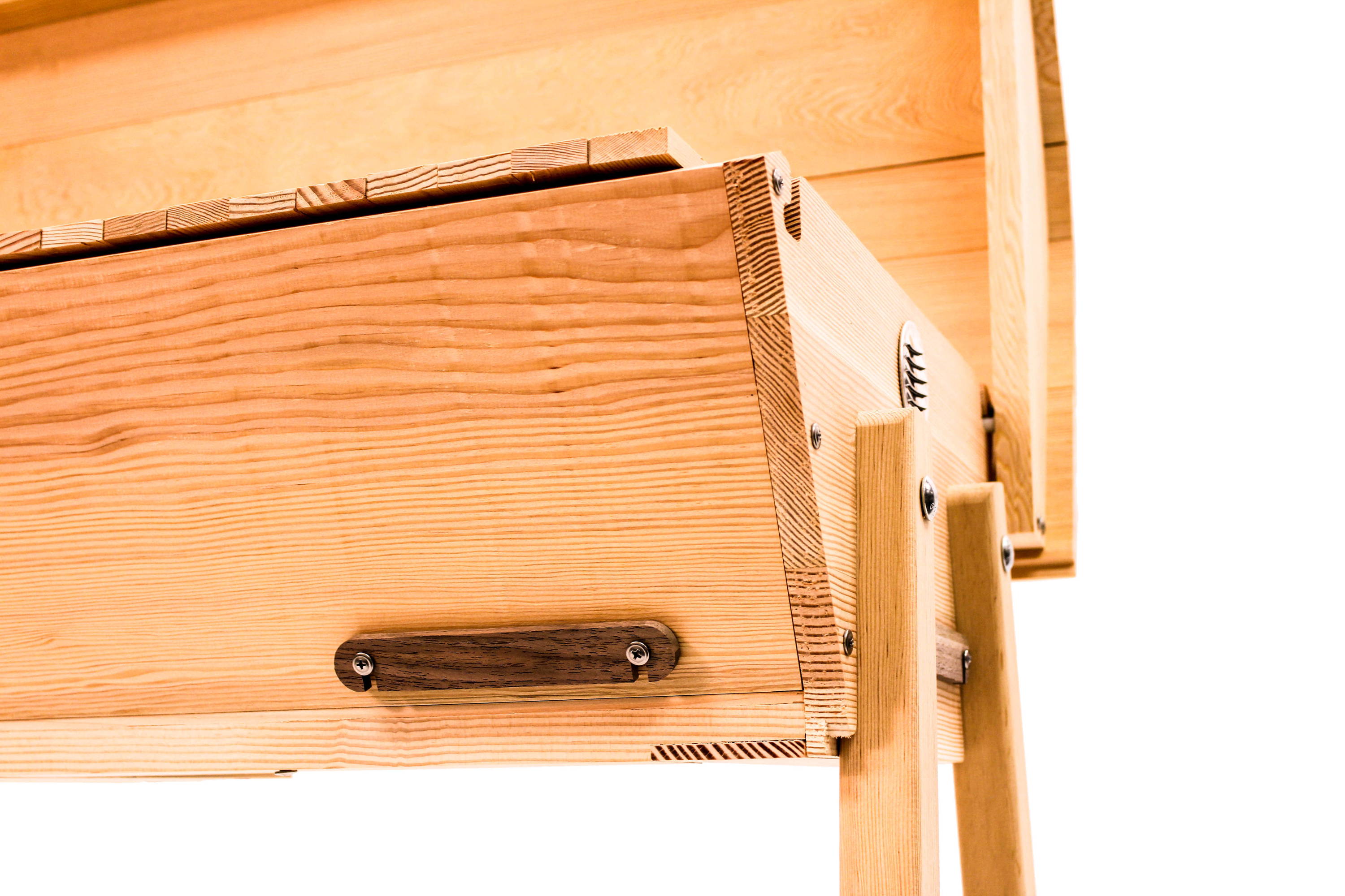 Top bar hive with walnut entrance covers