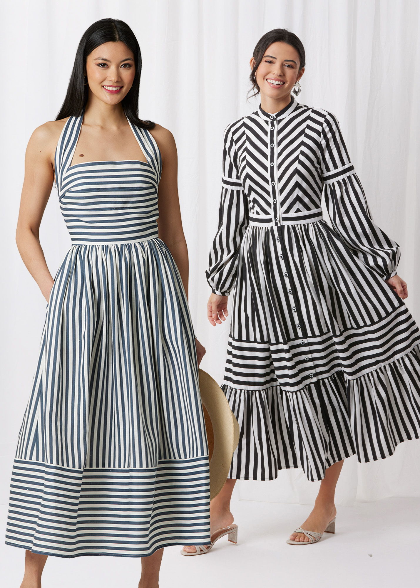 Two women wearing striped dresses, one in blue and white, the other in black and white.