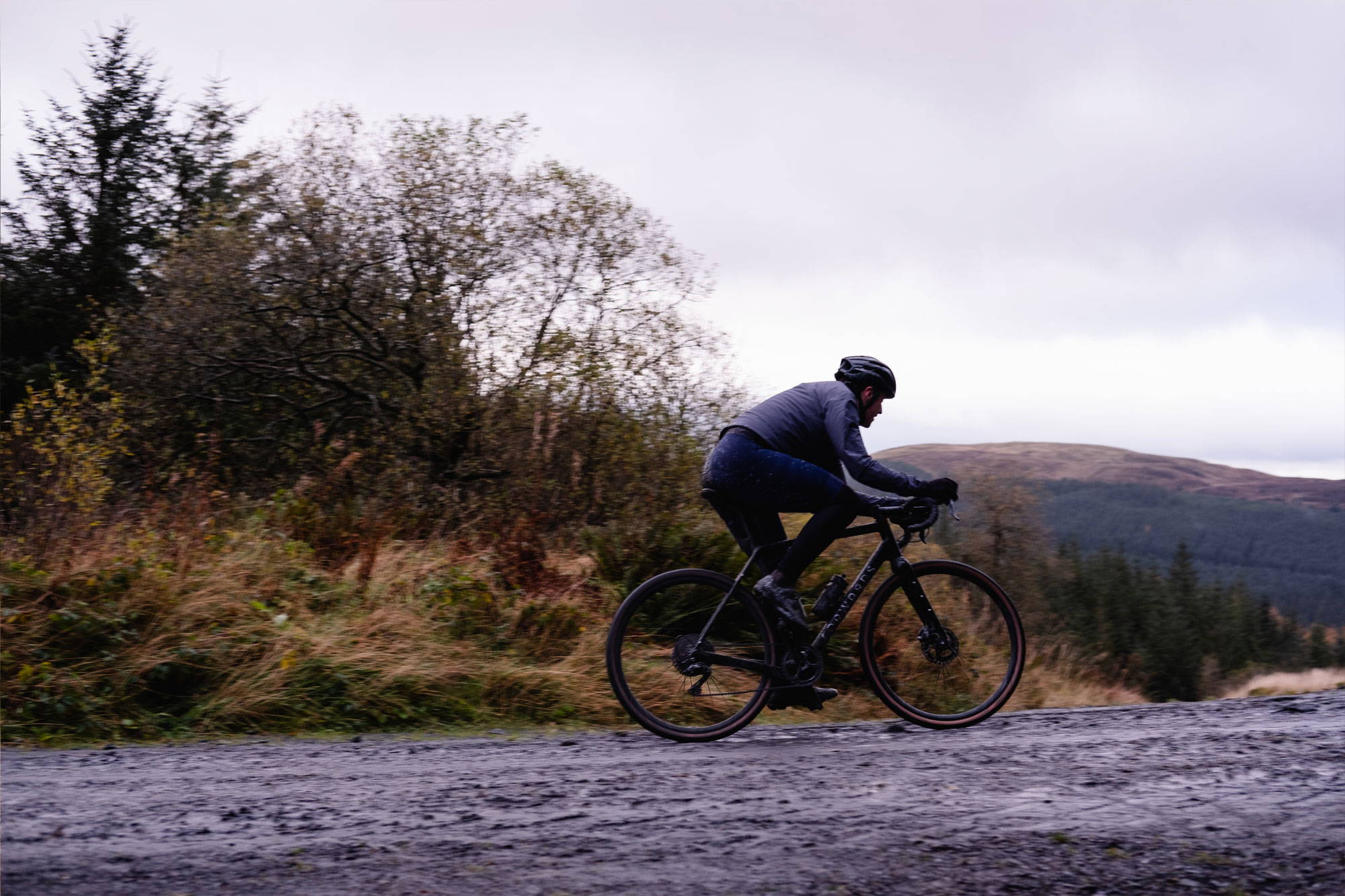 Rider on wet gravel path