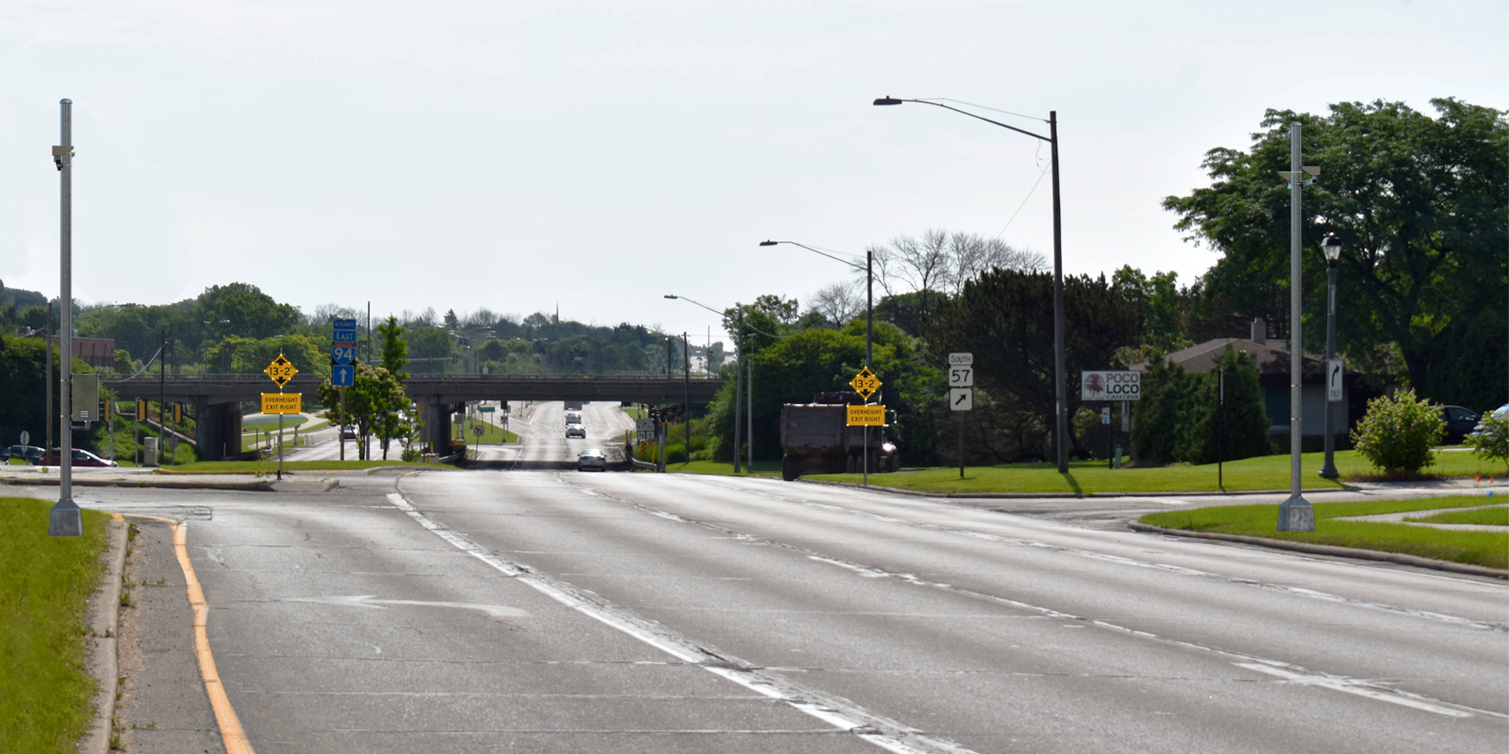 Low-bridge-over-a-highway-with-warning-alerts