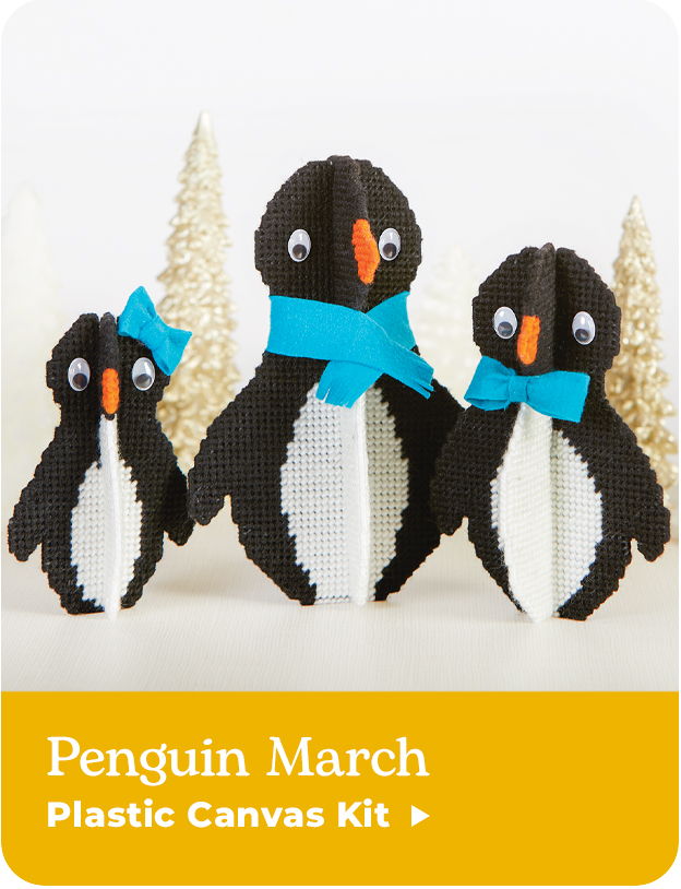 Three penguin figures with blue bows against a light background.