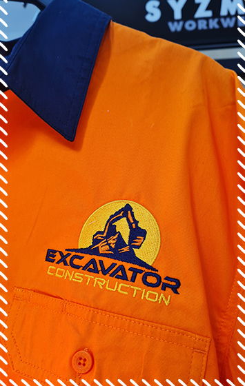Orange hi-vis work shirt with embroidered Excavator Construction logo on the chest in navy and yellow thread