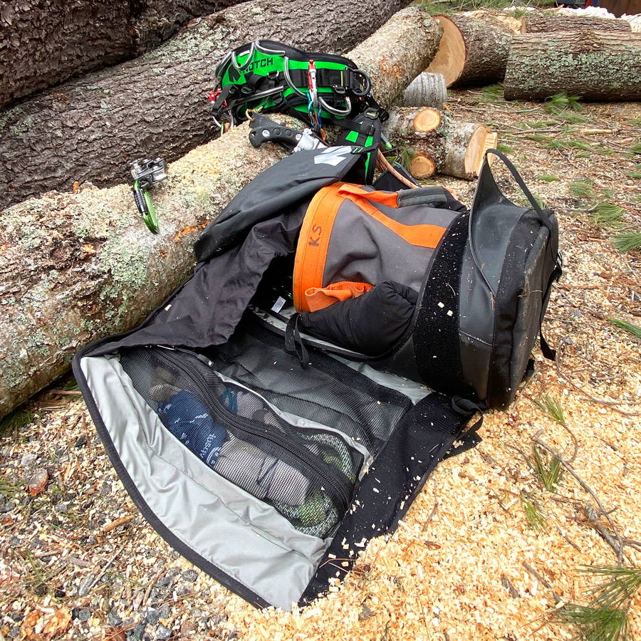 Notch Pro Access Bag laying open on the forest floor, showing tree climbing gear inside