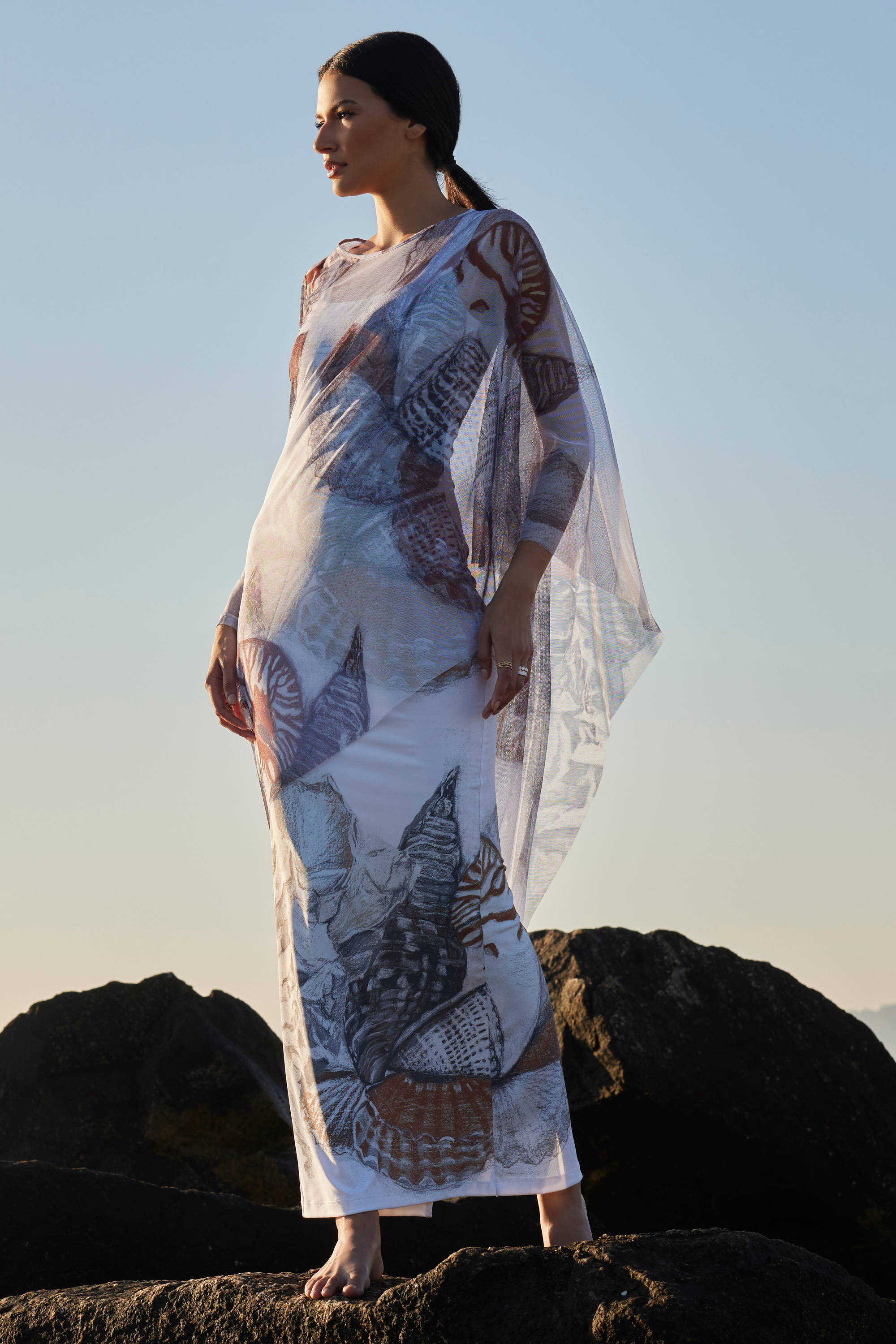 Woman wearing mesh one armed kaftan by Ala von Auersperg for resort 2024