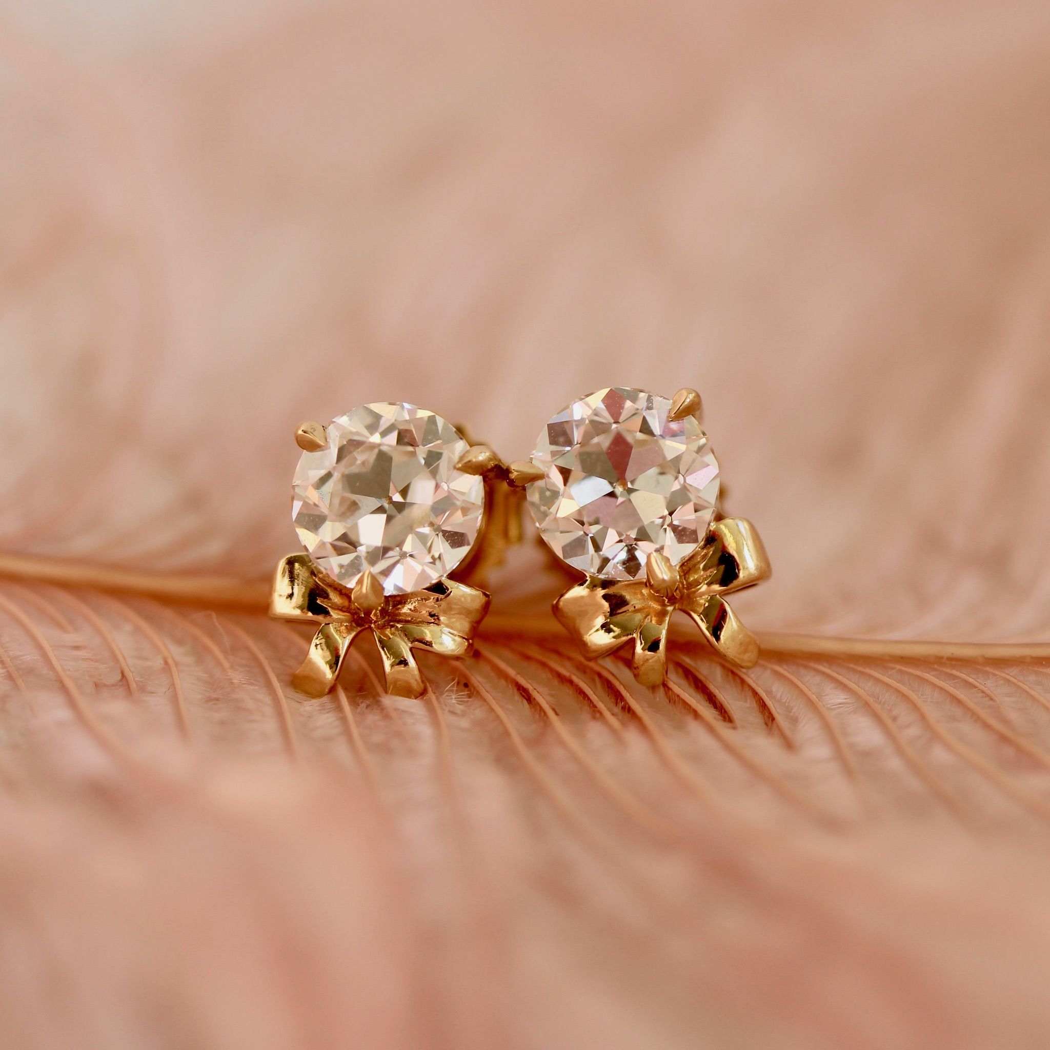 Old European cut diamond earrings with yellow gold bows by Cat Cason Fine
