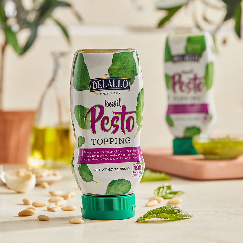 DeLallo squeeze bottle pesto topping sitting on a table