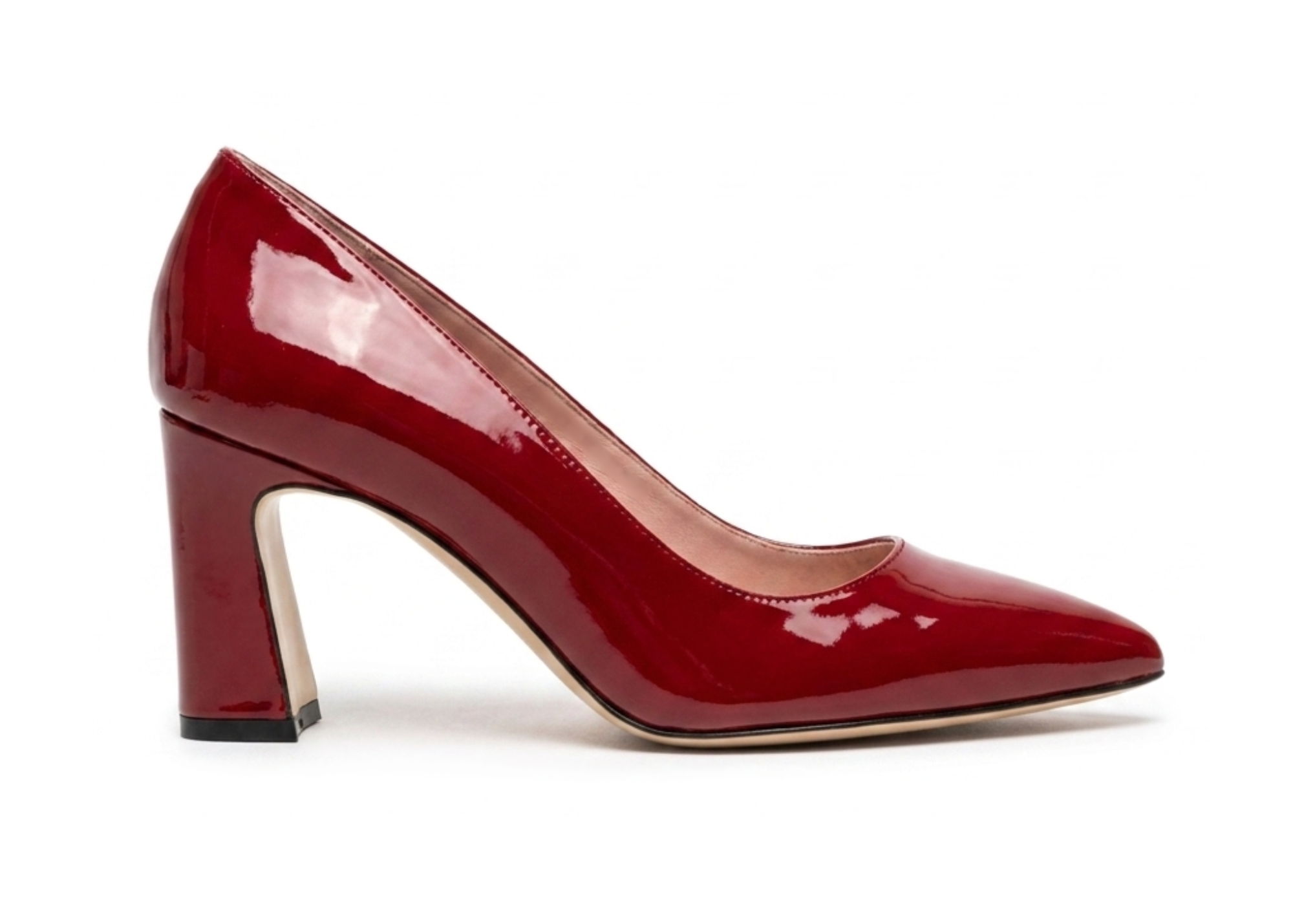 Red patent leather high-heeled shoe with a chunky heel.