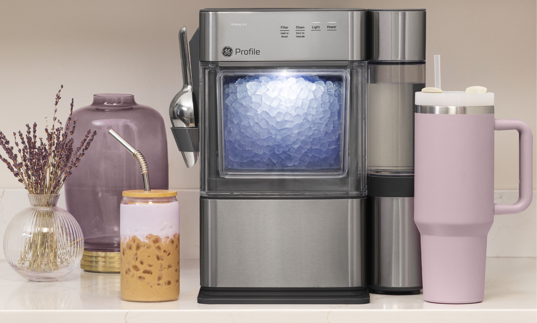 A countertop drink dispenser with various beverages and decorative items.