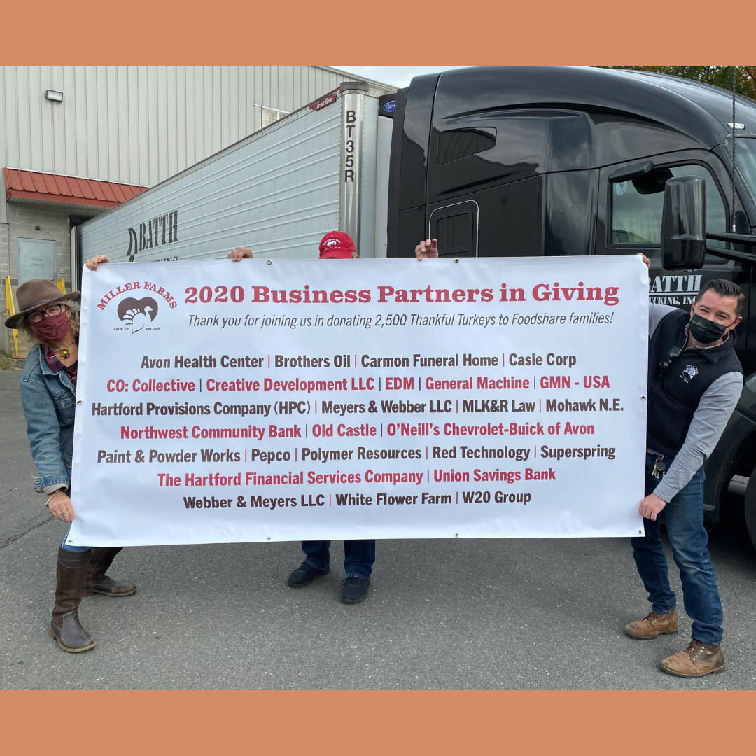 Three Oma's Pride employees in front of truck celebrating 2020 Business Partners in Giving.