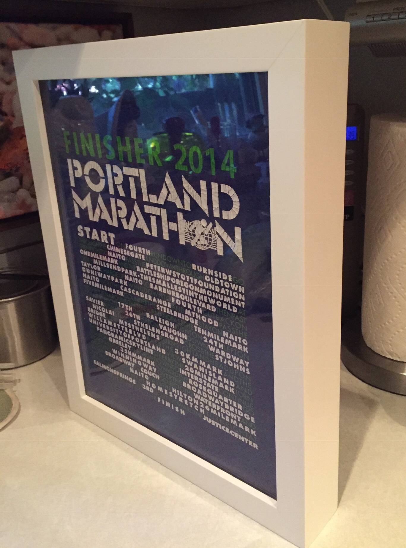 Portland Marathon tee shirt framed and displayed in a Shart Premium Square T-Shirt Frame Display Case - White