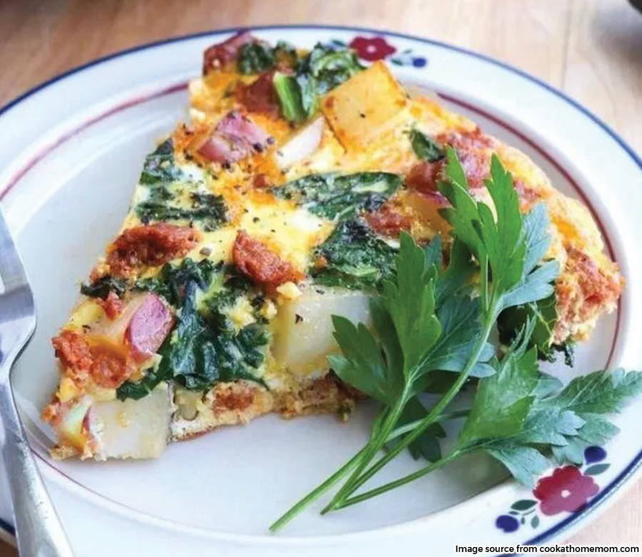 slice of frittata on plate garnished with parsley