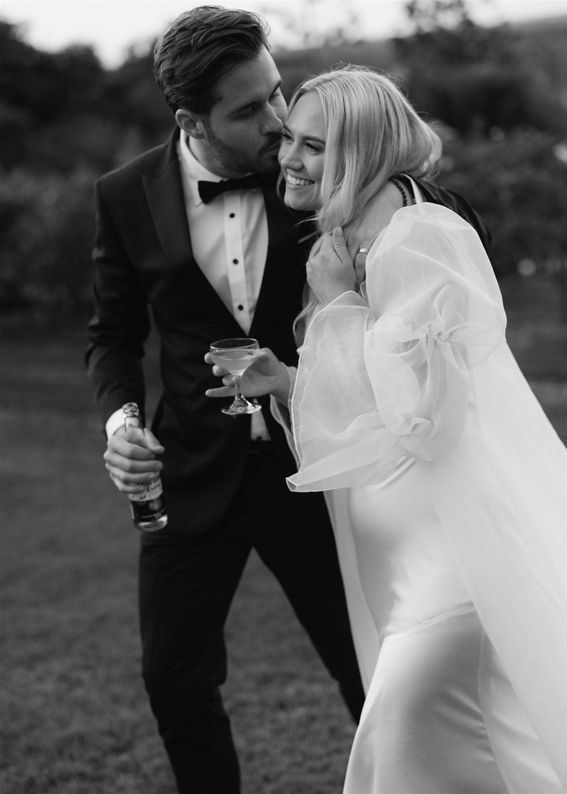 Groom holding bride