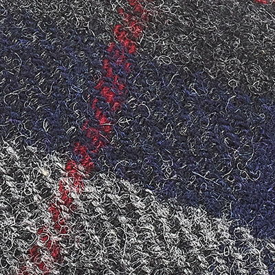 Navy blue, grey and red Harris Tweed fabric with contrasting woven texture.