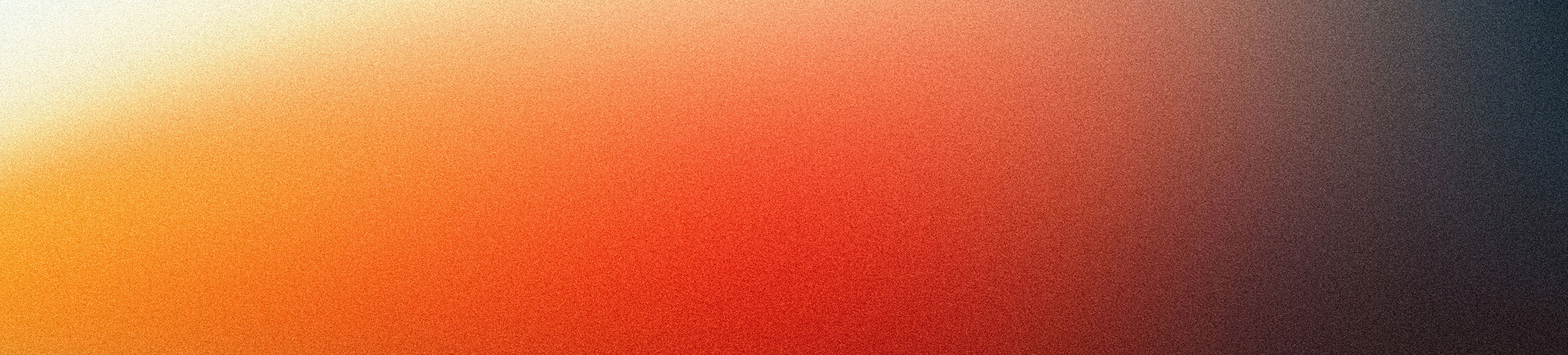 Abstract gradient of warm colors transitioning to dark hues.