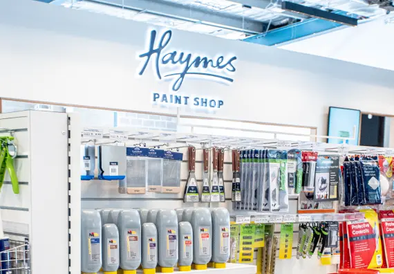 Haymes Paint Shop display with various paint supplies and tools.