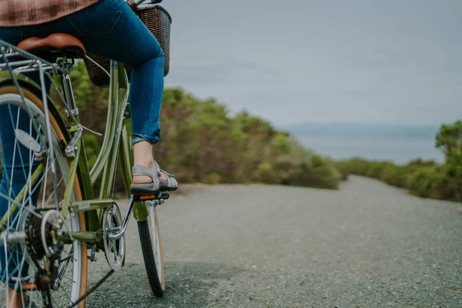 woman wearing outdoor sandals for biking adventure