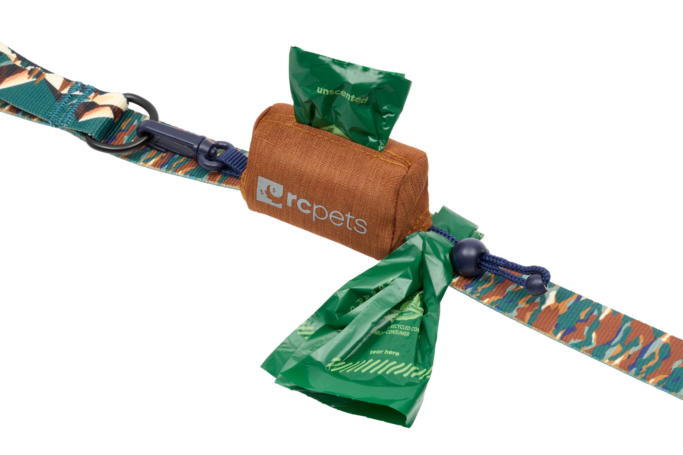 Dog waste bag dispenser with patterned strap and green bags.