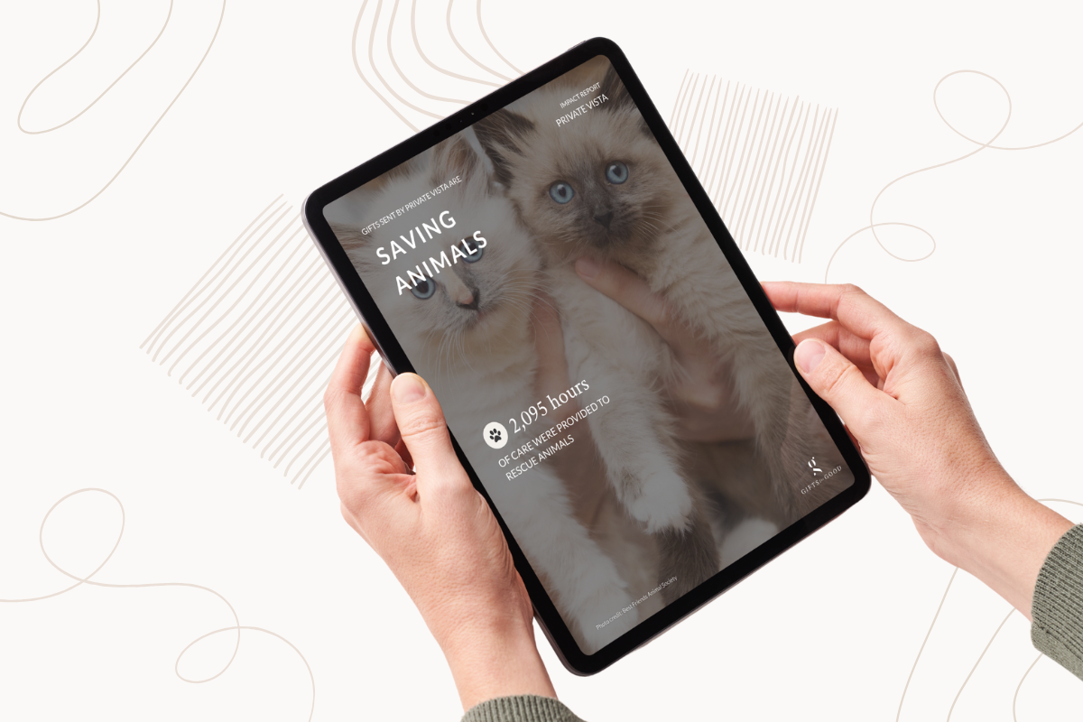 Person holding a tablet displaying a Private Vista's 2025 impact on animal welfare.