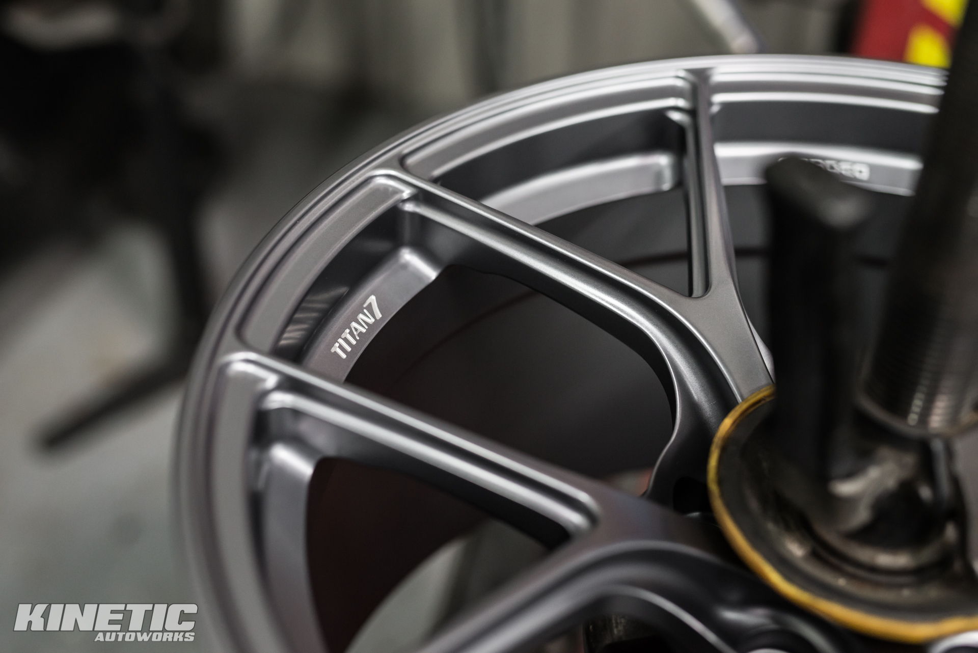 Close-up of an aftermarket wheel at Kinetic Autoworks