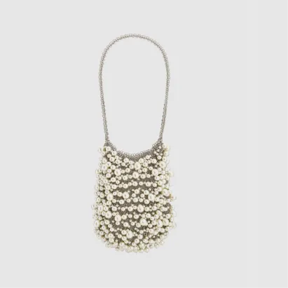 Beaded handbag with a chain strap on a light background.