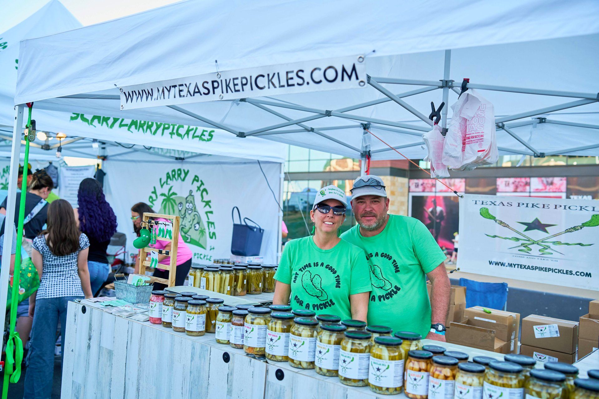Texas Pike Pickles vendor activation featuring 'Anytime is a good time for a pickle' branded apparel and a full lineup of dill pickle, hot dill, and signature 'Come and Take 'Em' pickle products at The Big Dill pickle festival, Globe Life Field and Texas Live!, Arlington Texas 2025.