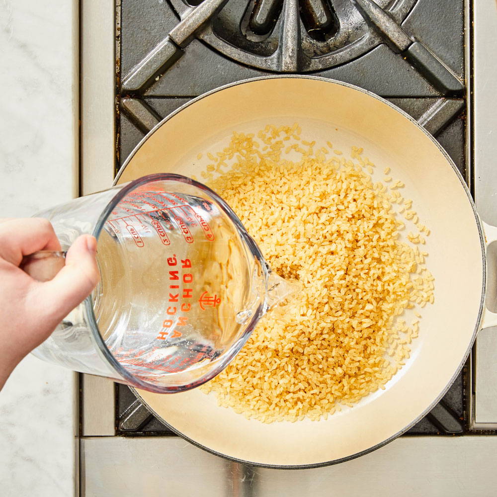 How to make risotto: add water to sauce pan