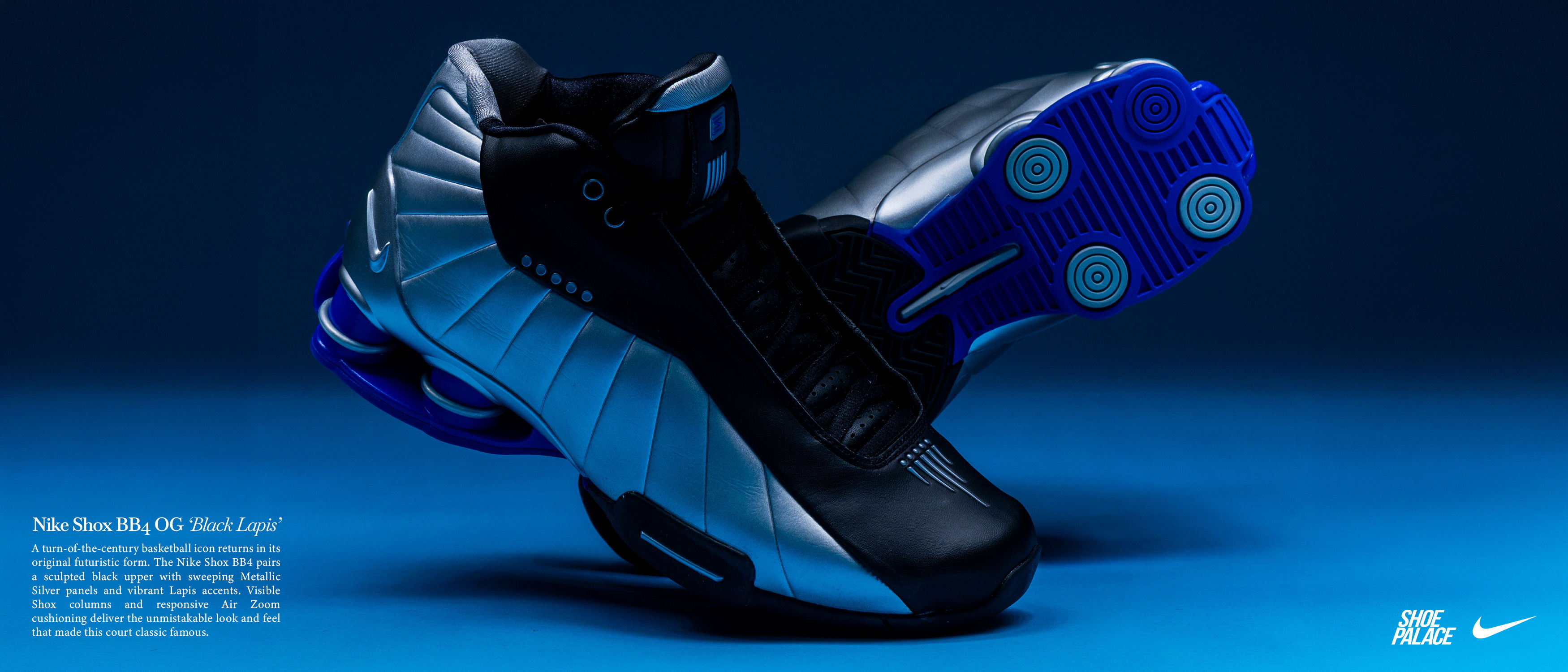 Black and silver athletic shoes on a blue background.