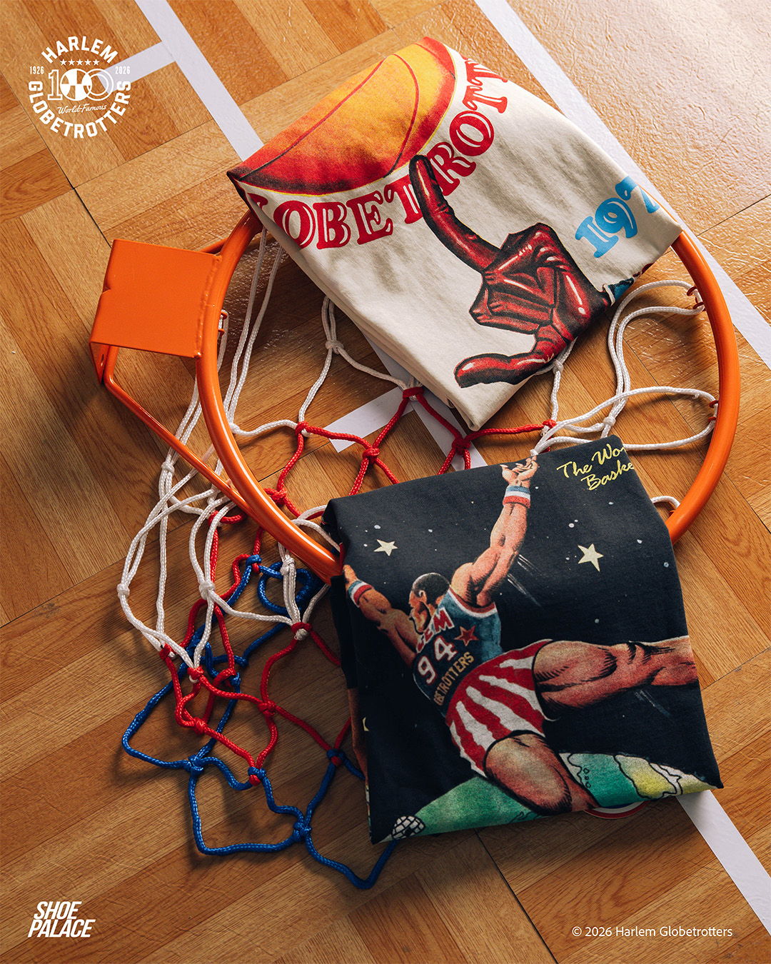 Basketball hoop with decorative cushions on a wooden floor.