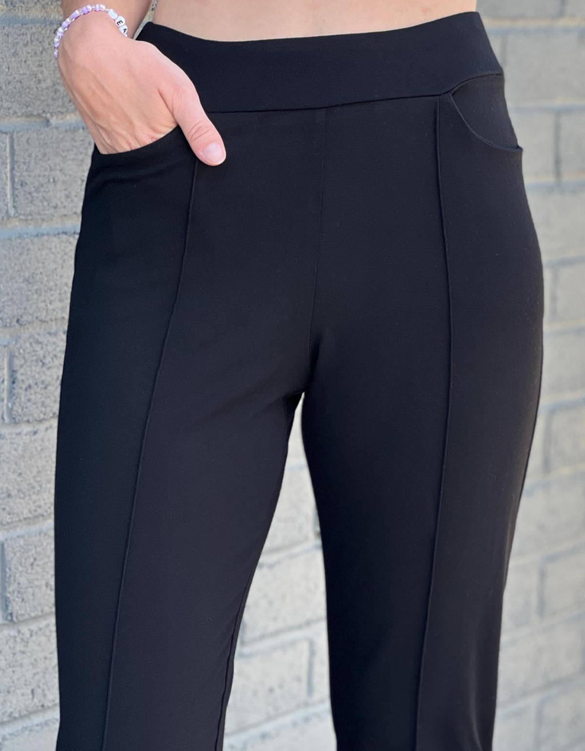Close up of Miik's Christal pull-on pintuck ankle pant waistband and pockets.