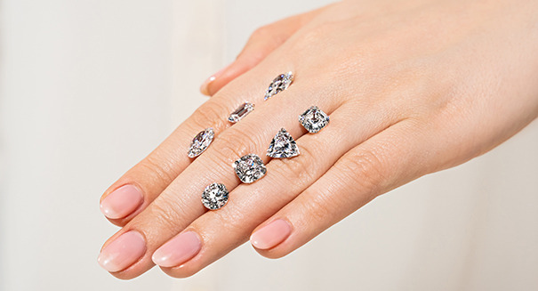 Various diamond shapes resting on a hand