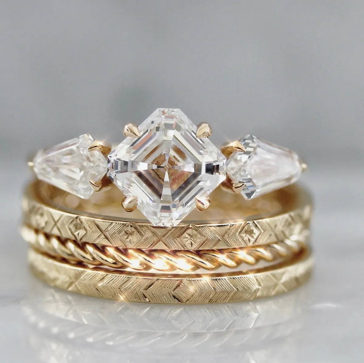 Asscher Cut Diamond Ring with kite diamond sides