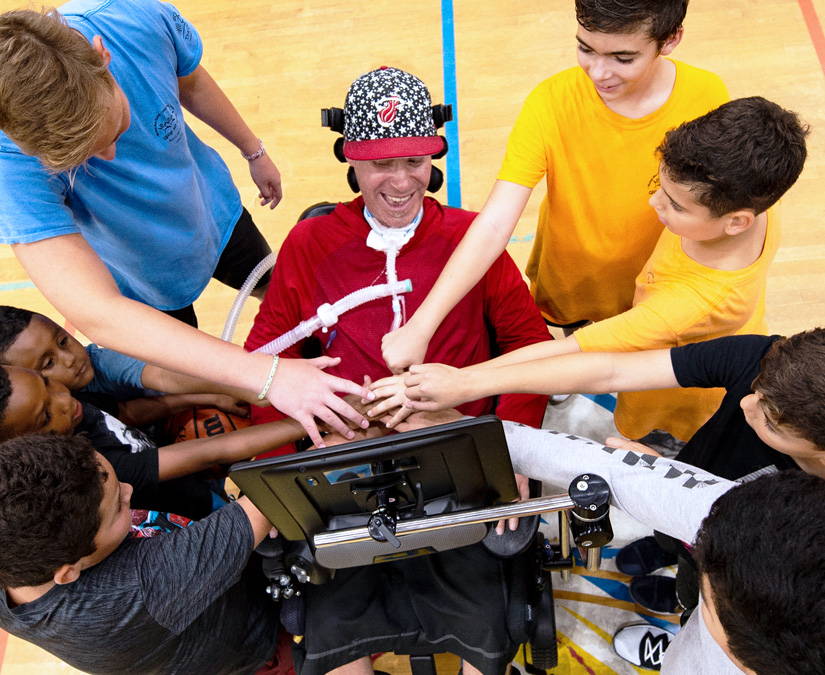 Man using the Tobii Dynavox I-Series to coach a basketball team 