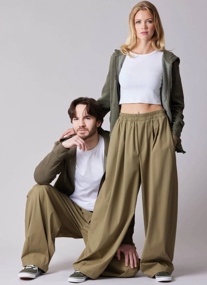 Two models wearing casual outfits with oversized pants and hoodies.