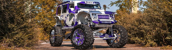 Panoramic front three-quarter lifted white purple 2017 Jeep Wrangler ALL IN grille chrome wheels Chad's Conductor's Special 244K Spare Tire Delete train horn kit featured customer install gallery photo 1