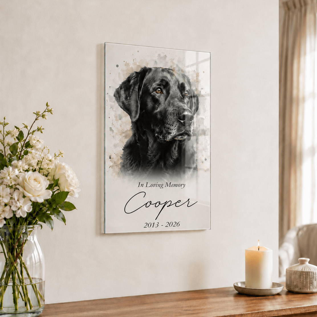 Framed portrait of a dog named Cooper with flowers and candles nearby.